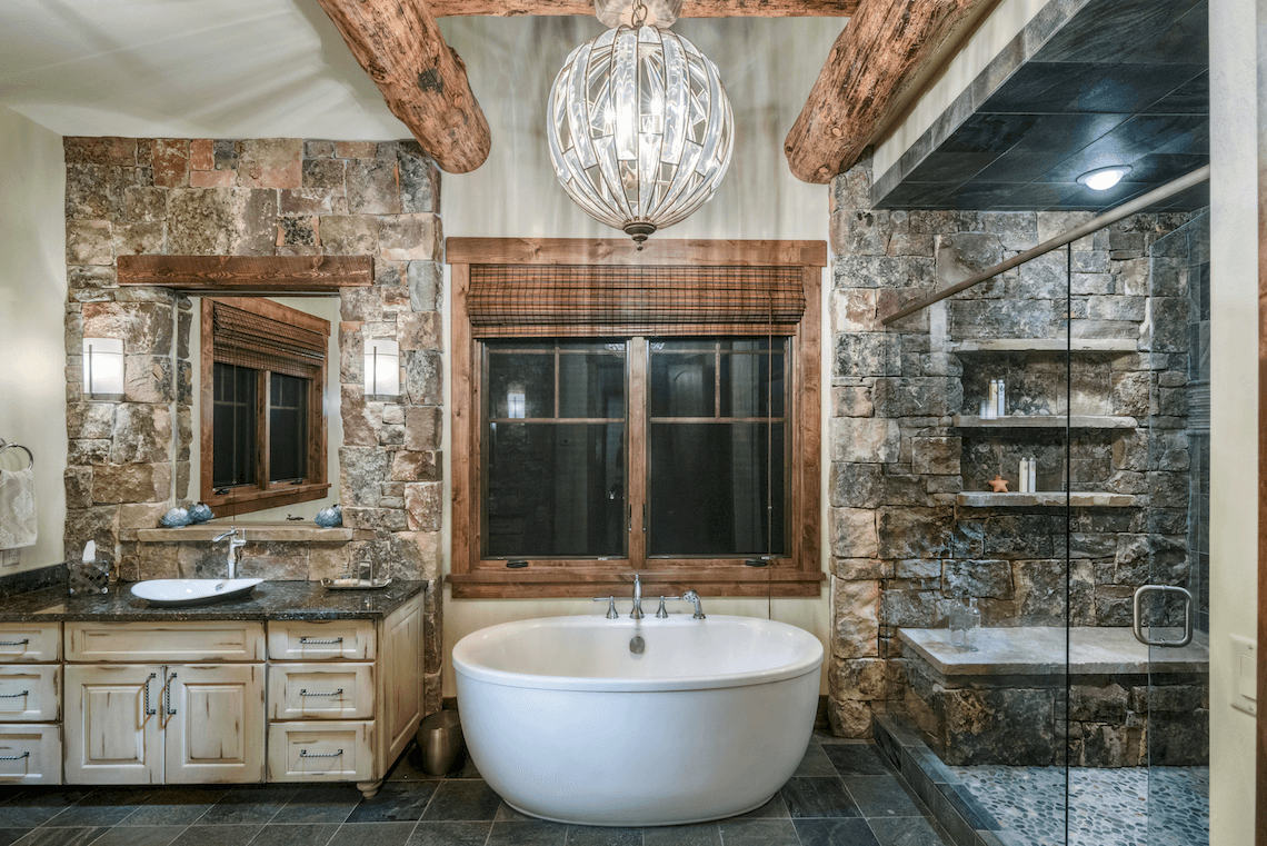 Rustic Master Bathroom with Wood Beams, Stone Shower and Freestanding Bathtub