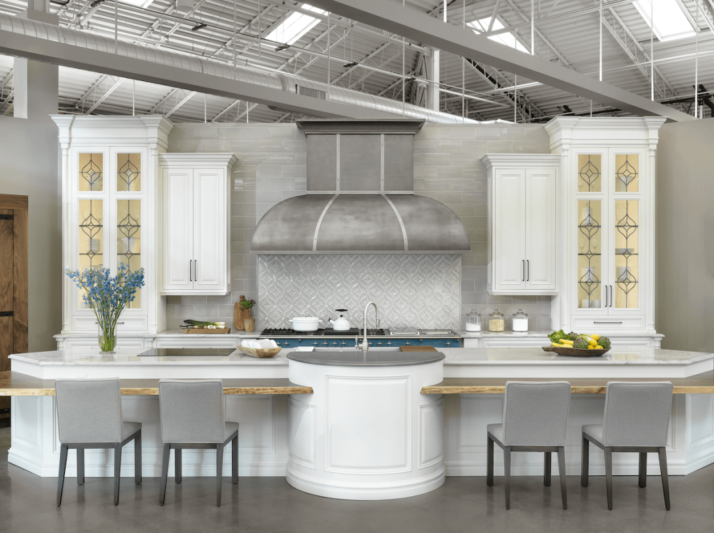 Beck/Allen Showroom | White kitchen designed by Beck/Allen Cabientry featuring a Lacanche range.